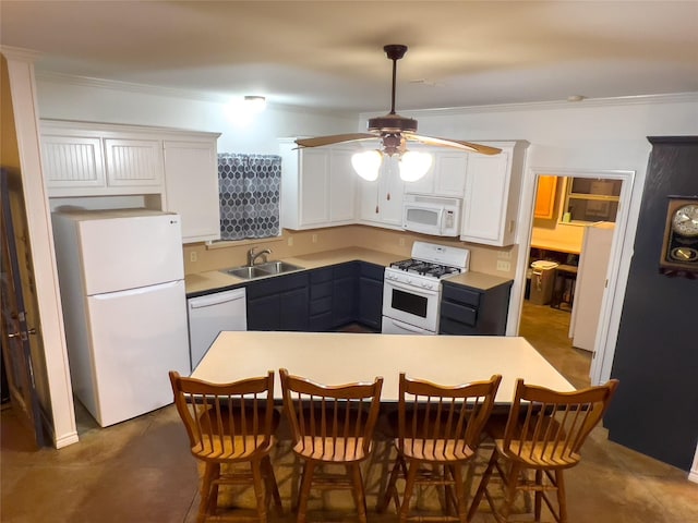 kitchen with white cabinetry, sink, a kitchen bar, ornamental molding, and white appliances