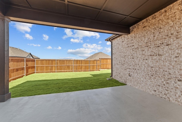 view of yard featuring a patio and a fenced backyard