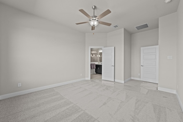 unfurnished bedroom with baseboards, visible vents, and light colored carpet