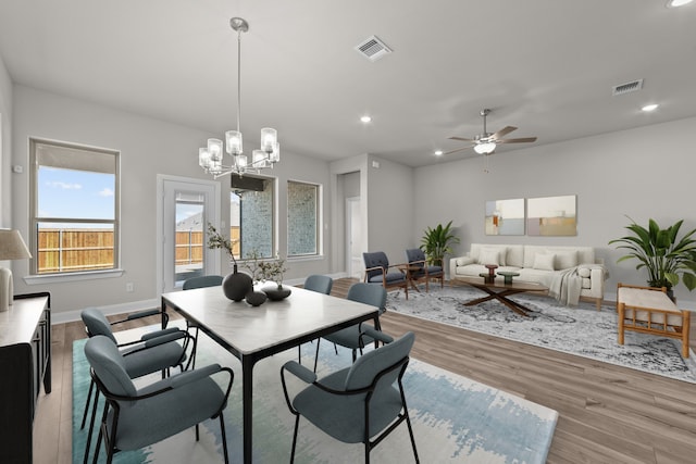 dining space featuring recessed lighting, visible vents, light wood-style flooring, and baseboards