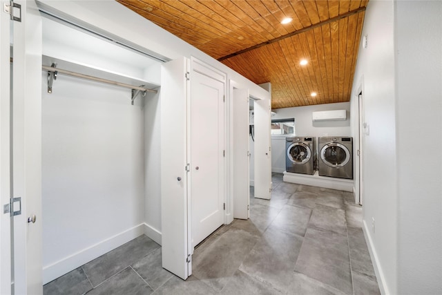 clothes washing area featuring wooden ceiling and washing machine and clothes dryer