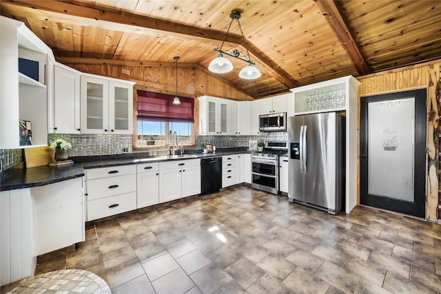 kitchen featuring decorative light fixtures, appliances with stainless steel finishes, sink, and white cabinetry