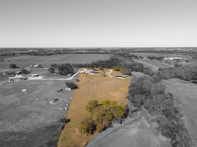 birds eye view of property featuring a rural view