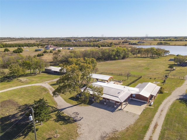 birds eye view of property with a rural view and a water view