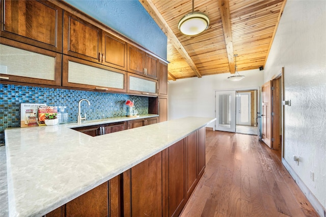 kitchen featuring dark hardwood / wood-style flooring, wood ceiling, tasteful backsplash, and pendant lighting