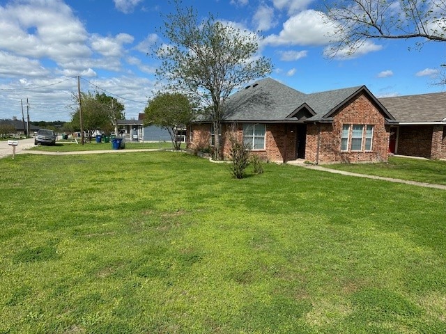 view of front of home with a front yard