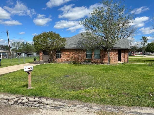 ranch-style home with a front yard