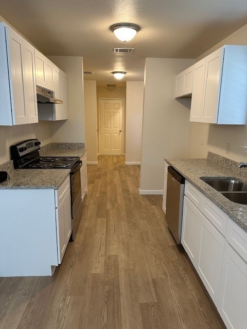 kitchen featuring electric range, sink, stainless steel dishwasher, dark hardwood / wood-style floors, and white cabinets