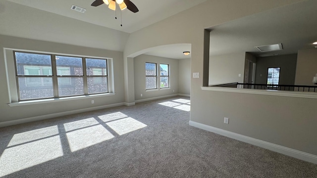 11817 Serval St, Godley, TX 76044 - spare room with a ceiling fan, carpet floors, vaulted ceiling, baseboards, and arched walkways