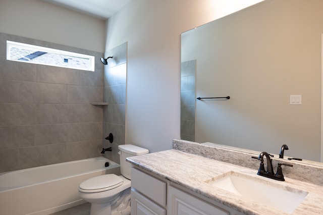 full bathroom with vanity, tiled shower / bath combo, and toilet