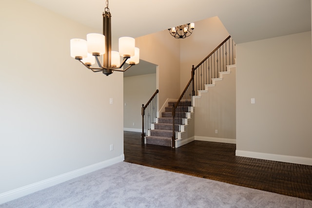 interior space featuring hardwood / wood-style floors and an inviting chandelier