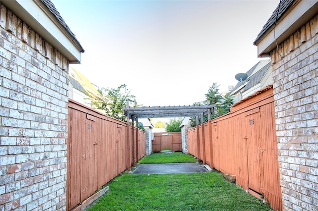 view of yard with a pergola and a patio