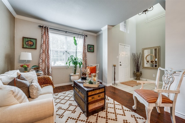 living room with crown molding and hardwood / wood-style flooring