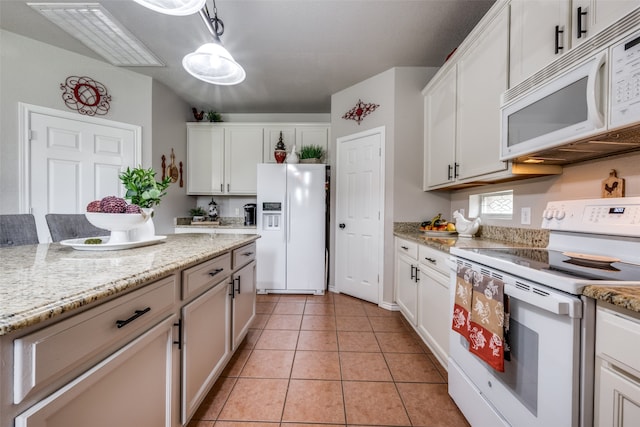 kitchen featuring white cabinetry, white appliances, and light tile patterned floors