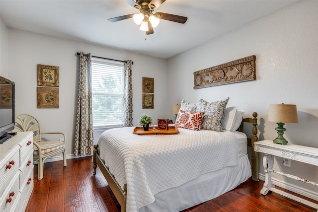 bedroom featuring ceiling fan and dark wood-type flooring