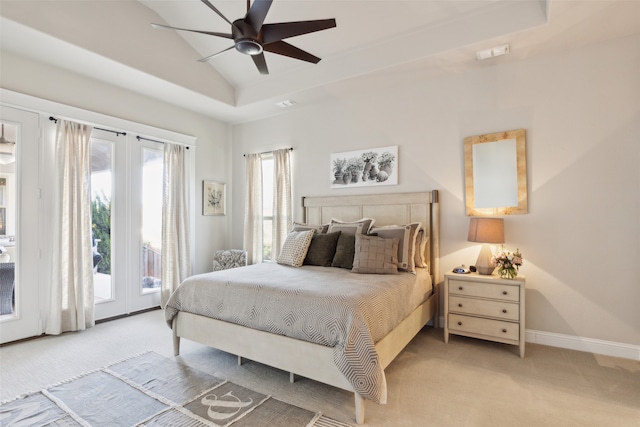 carpeted bedroom with ceiling fan, access to exterior, and vaulted ceiling