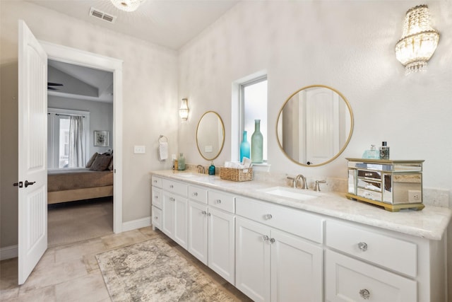 2005 Tremont Blvd, Mckinney, TX 75071 - ensuite bathroom featuring double vanity and baseboards