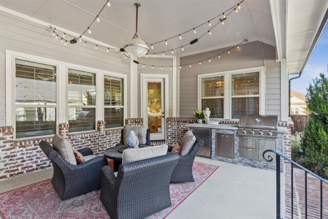 view of patio with exterior kitchen and grilling area