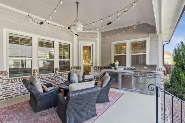 view of patio with exterior kitchen and grilling area