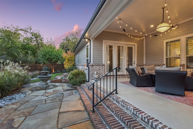 patio terrace at dusk with french doors