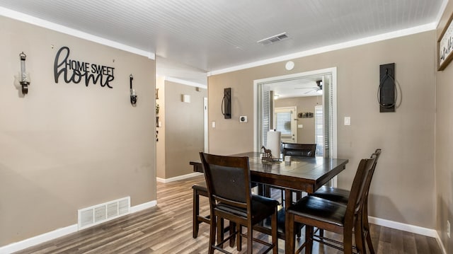 dining space featuring ceiling fan and wood-type flooring