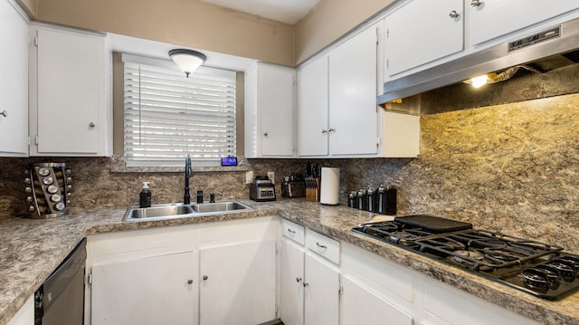 kitchen with tasteful backsplash, white cabinetry, sink, and black gas stovetop