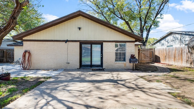 rear view of house with a patio