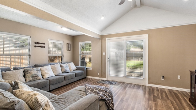 living area with a ceiling fan, wood finished floors, baseboards, and vaulted ceiling with beams