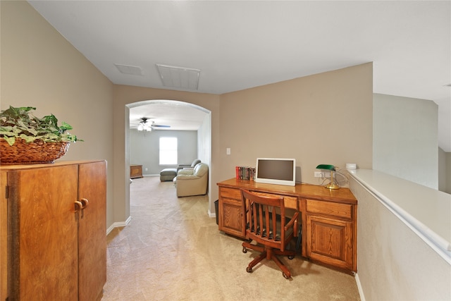 carpeted office featuring ceiling fan