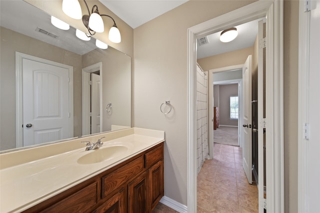 bathroom with vanity and tile patterned floors