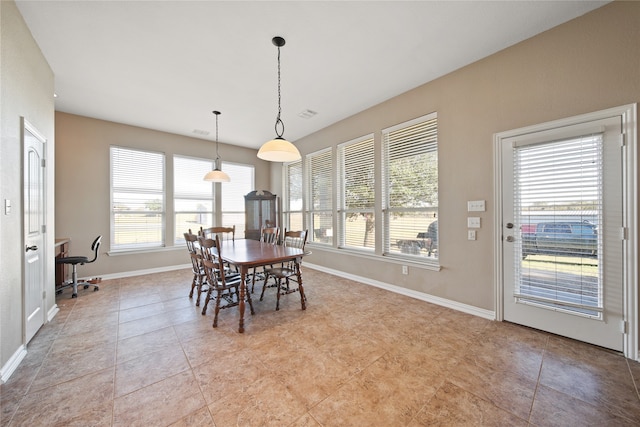 dining space with light tile patterned floors