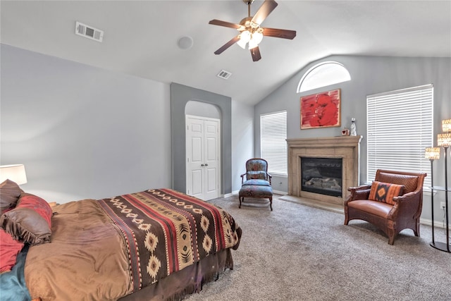 bedroom with carpet flooring, ceiling fan, and vaulted ceiling