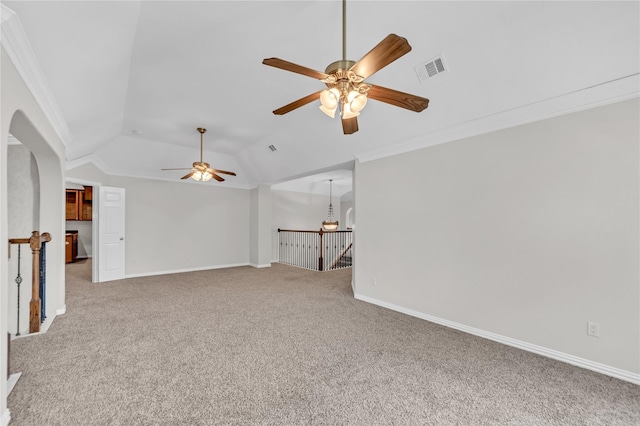 carpeted empty room with ornamental molding, ceiling fan with notable chandelier, and lofted ceiling