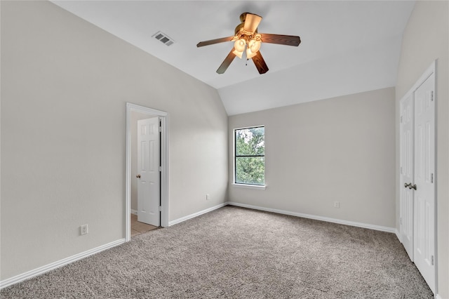 unfurnished bedroom featuring ceiling fan, light carpet, and lofted ceiling