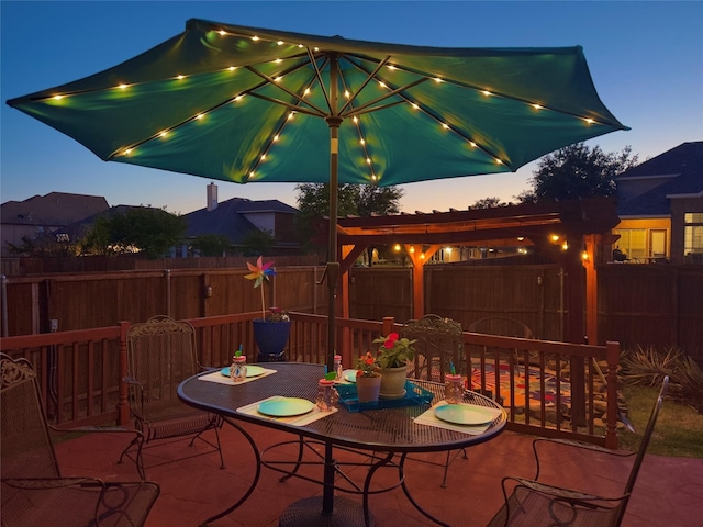 view of patio terrace at dusk