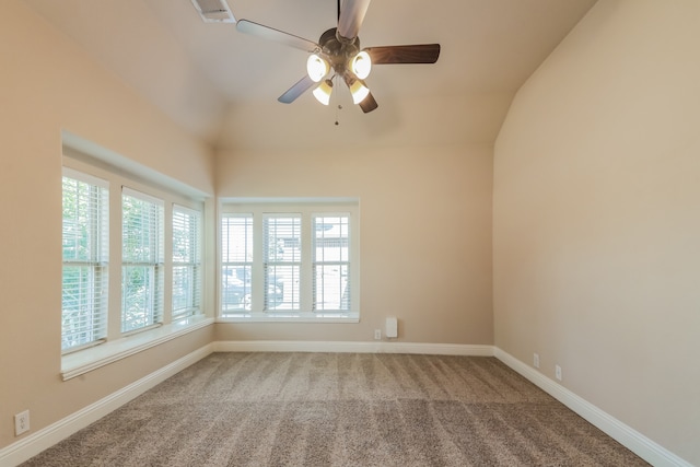 spare room featuring ceiling fan, carpet, and vaulted ceiling