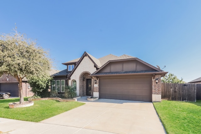 view of front of house with a garage and a front lawn