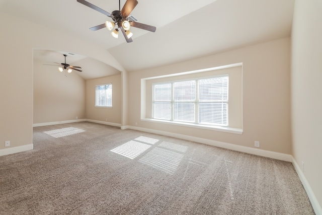 unfurnished room with ceiling fan, light colored carpet, and lofted ceiling