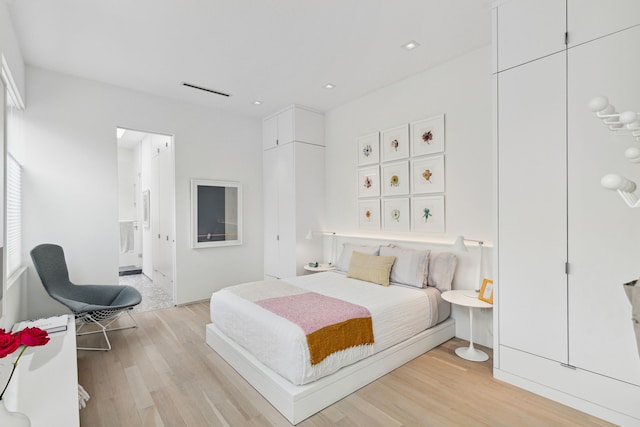 bedroom featuring light wood-type flooring