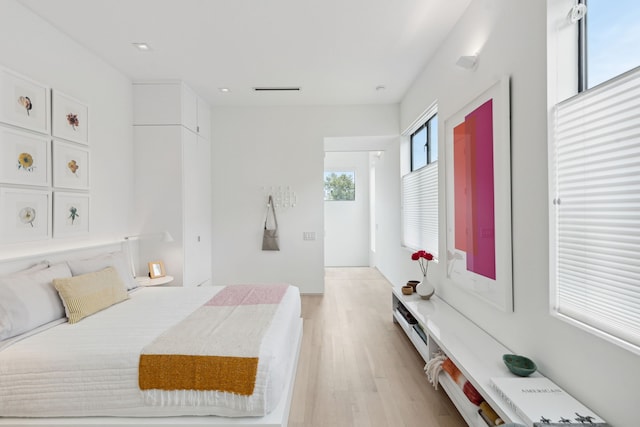 bedroom with light wood-type flooring