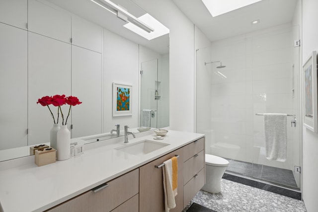 bathroom with walk in shower, vanity, and toilet