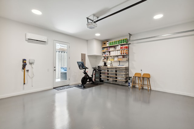 garage with a garage door opener and a wall mounted AC