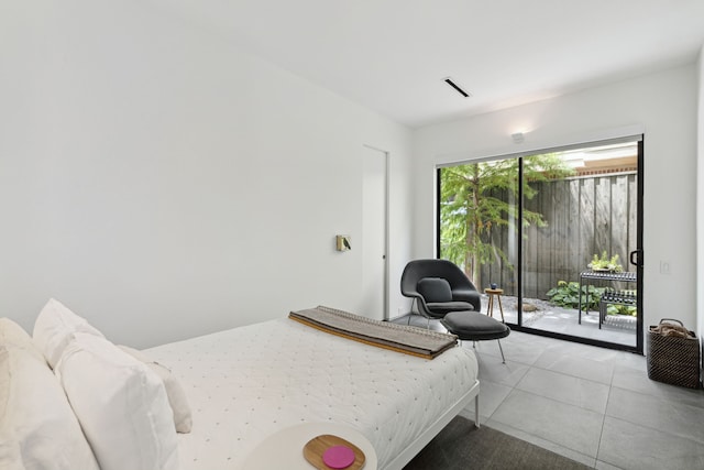 tiled bedroom featuring access to outside