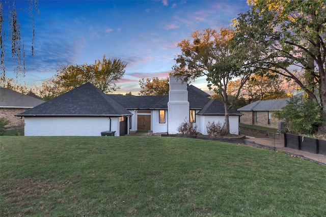 view of front of home featuring a yard