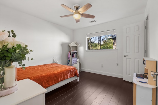 bedroom featuring ceiling fan and dark wood-type flooring