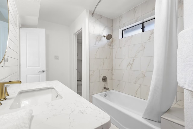 bathroom with shower / bath combination with curtain and vanity