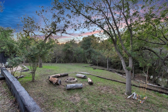 view of yard at dusk