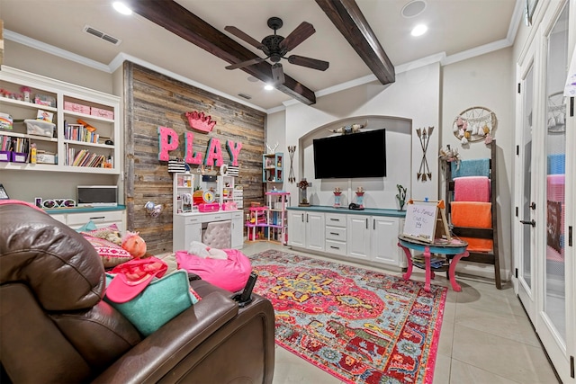 tiled living room featuring beam ceiling, ceiling fan, and ornamental molding