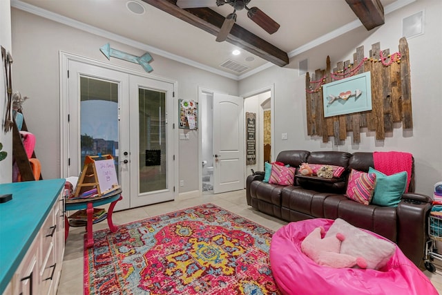 tiled living room with ceiling fan, french doors, beamed ceiling, and ornamental molding