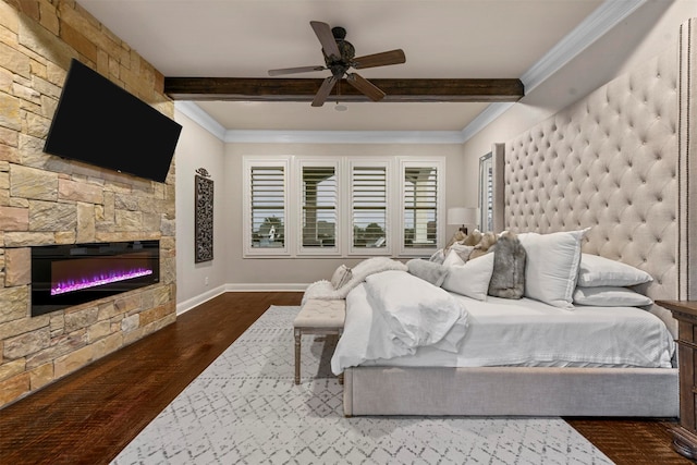 bedroom featuring ceiling fan, beamed ceiling, dark wood-type flooring, and ornamental molding